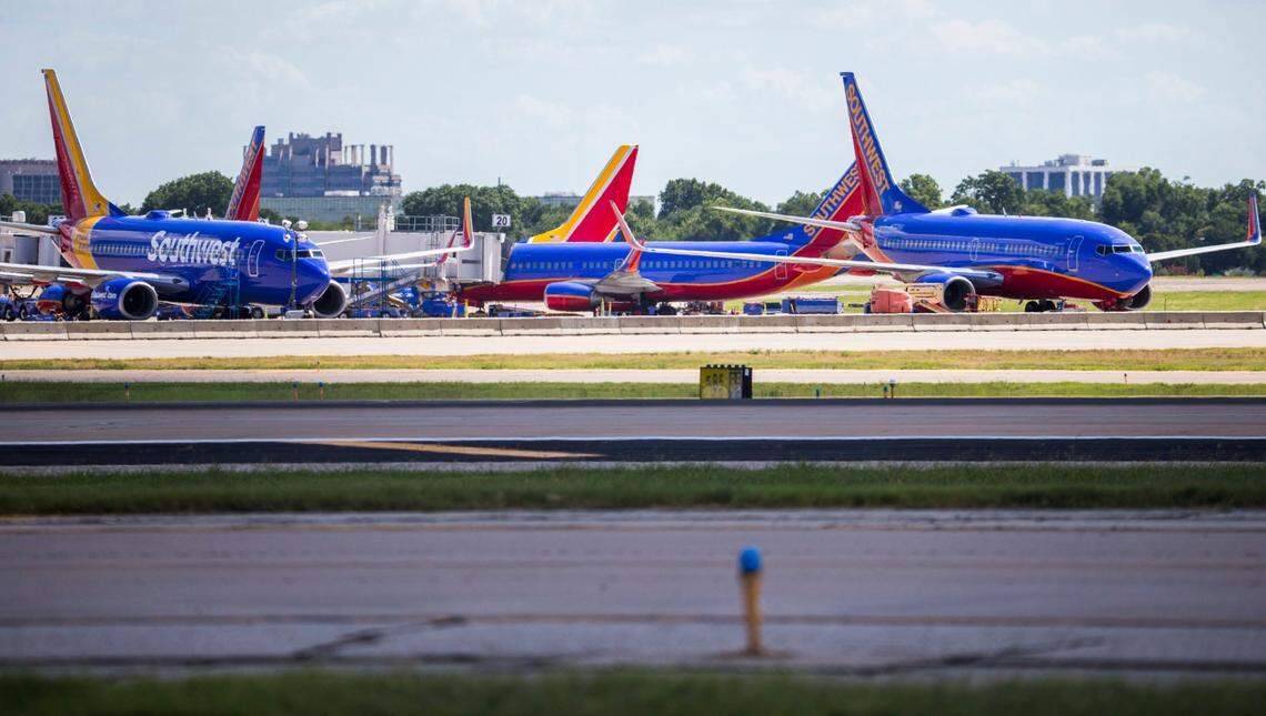 Southwest Airlines airplanes are parked at terminals at Dallas Love Field Airport in Dallas.