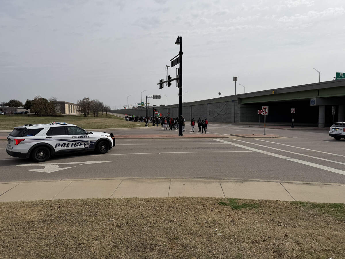 Euless police officers monitored the students as they protested down Highway 183 Friday morning.