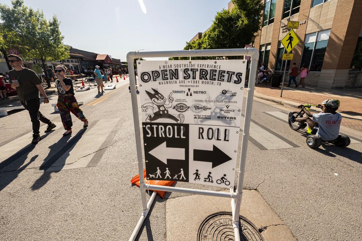 Event goers stroll while some roll at Open Streets on Magnolia Avenue in Fort Worth on Saturday, April 13, 2024. Open Streets is a national movement encouraging innovative ways to achieve environmental, social, economic, and public health goals by temporarily closing streets to automobile traffic, so that people may use them for walking, bicycling, dancing, playing, and socializing.