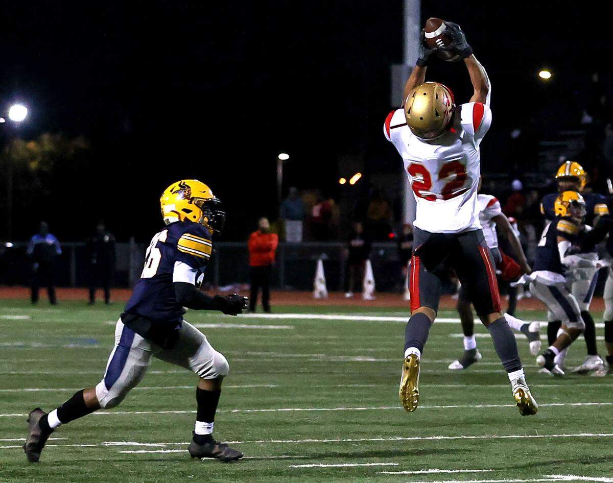 South Grand Prairie running back Jaden Stanley (22) comes up with reception against Arlington Lamar defensive back Braylon Cole (L) during the first half in a District 8-6A high school football game played at Cravens Field on Thursday, November 4, 2021, in Arlington. (Steve Nurenberg/Special to the Star-Telegram)