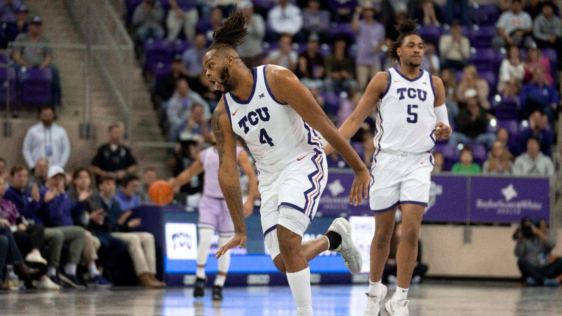 TCU center Eddie Lampkin Jr. (4) celebrates sinking a basket as Chuck O’Bannon Jr. (5) follows behind in the first half of an NCAA college basketball game against Kansas State in Fort Worth, Texas, Saturday, Jan. 14, 2023. (AP Photo/Tony Gutierrez)