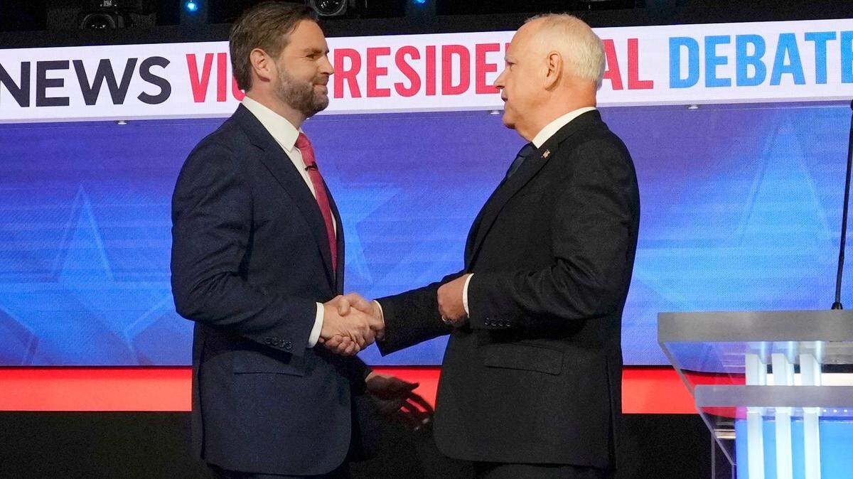 Republican JD Vance and Democrat Tim Walz greet before they square off during the CBS News vice presidential debate in New York City on Oct. 1, 2024.