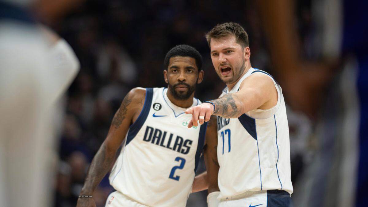 Dallas Mavericks guard Kyrie Irving (2) listens to guard Luka Doncic (77) will be in the lineup at home for the first time on Monday.