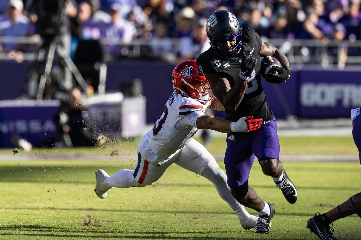 Arizona defensive back Dalton Johnson (43) tackles TCU wide receiver Savion Williams (3) in the first half of a NCAA football game at Amon G. Carter Stadium in Fort Worth on Saturday, Nov. 23, 2024.
