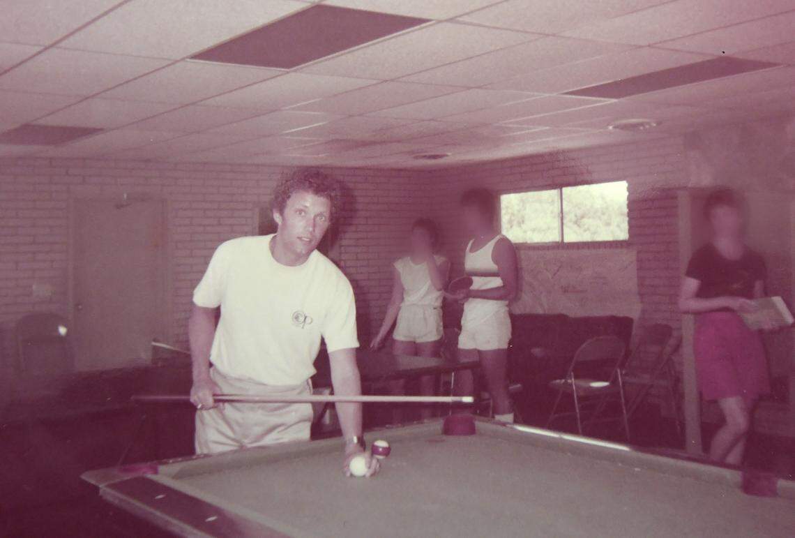 John Finley, former Travis Avenue Baptist Church youth minister, playing pool in the 1980s.