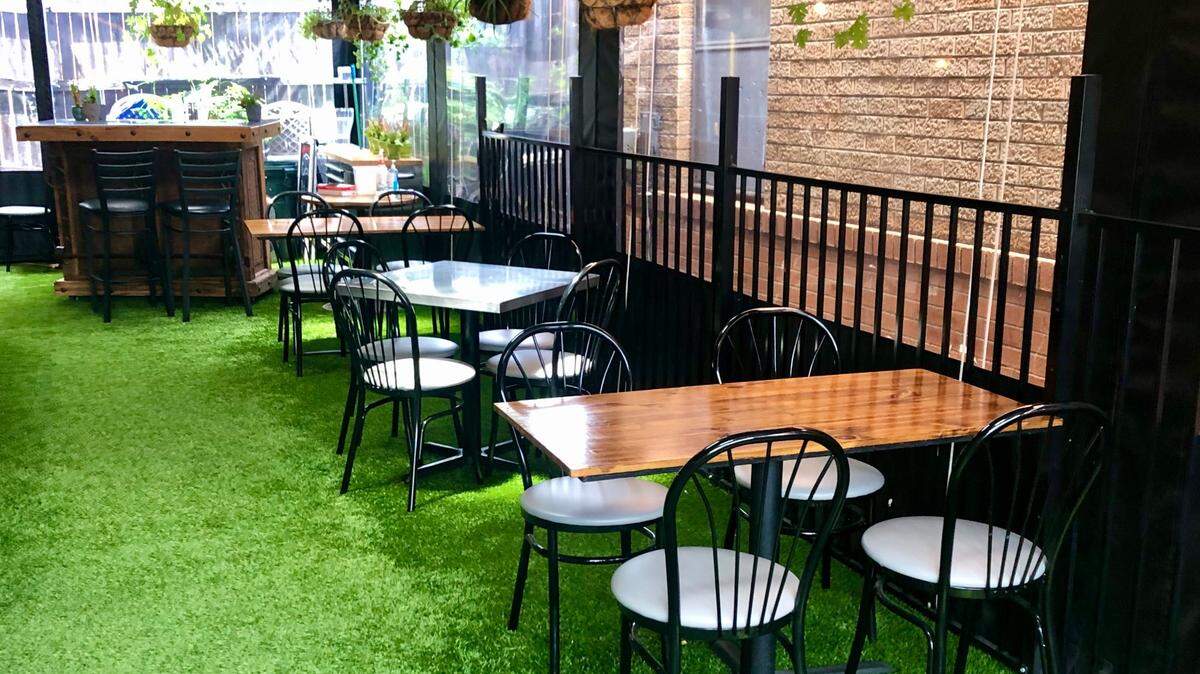 A side alley turned into a garden patio at Lili’s Bistro.