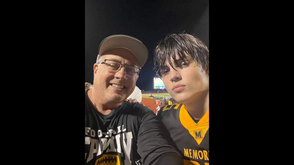 Jeff Metcalf with his son Austin, who was MVP on the Frisco Memorial High School football team. 