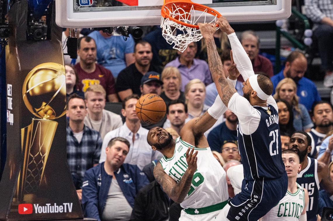 Dallas Mavericks forward Daniel Gafford (27) dunks over Boston Celtics center Xavier Tillman Sr. (26) in the first quarter of game 3 of the 2024 NBA Finals at American Airlines Center in Dallas on Wednesday, June 12, 2024.