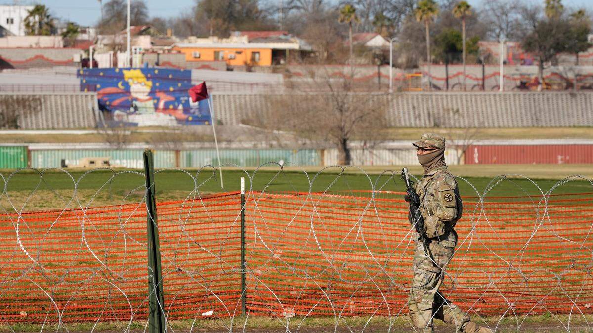 A National Guard soldier guards Shelby Park in Eagle Pass on Feb. 4. A new Texas law Texas state law makes it a misdemeanor to cross the international border without authorization.
