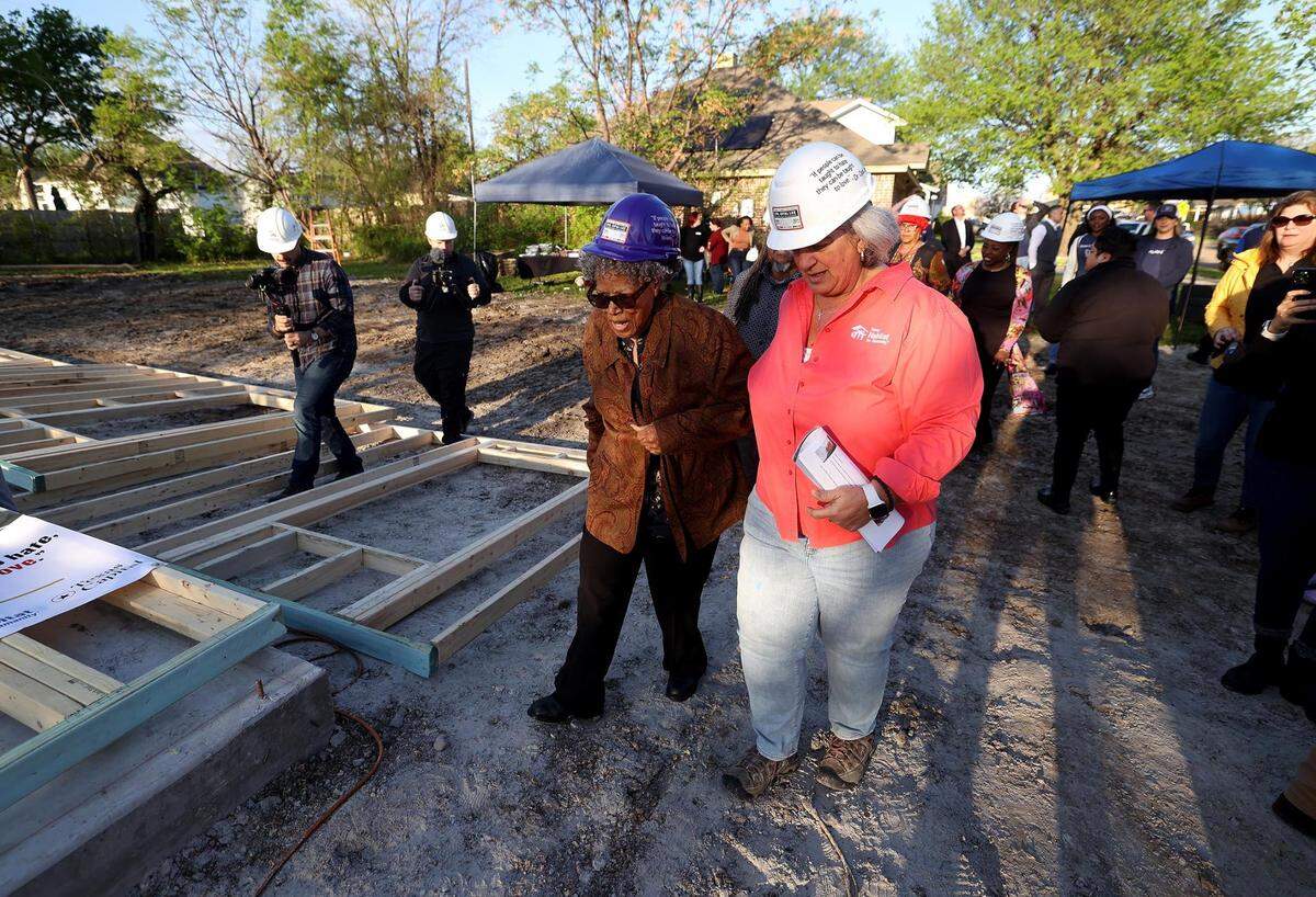 Opal Lee is escorted to the concrete slab of what will be her new home for the beginning of ceremony to mark the occasion on Thursday, March 21, 2024, in Fort Worth.