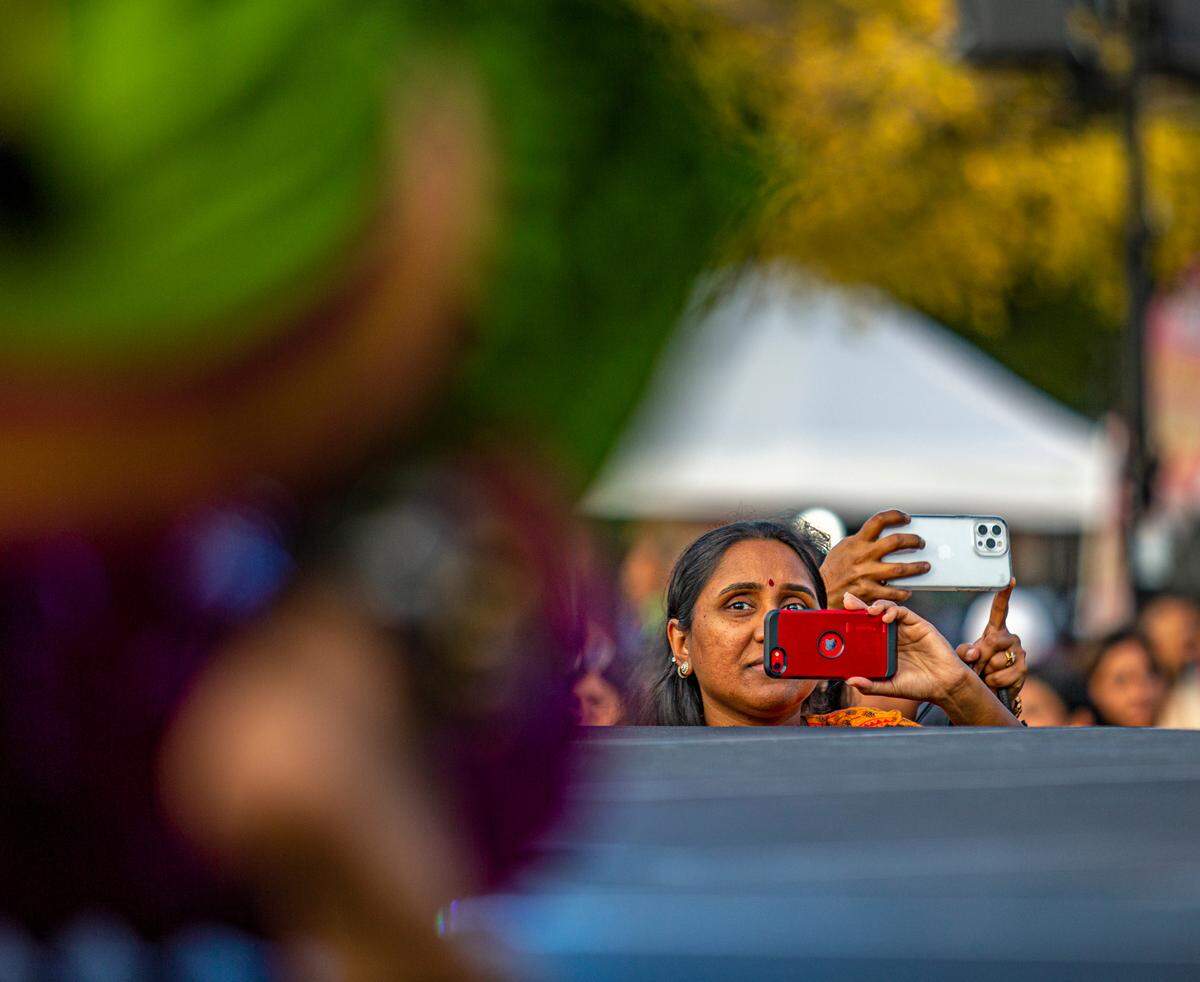 Many crowded the edge of the stage to snap photos and shoot video of performers at the celebration of Diwali in Southlake, Texas, Saturday.