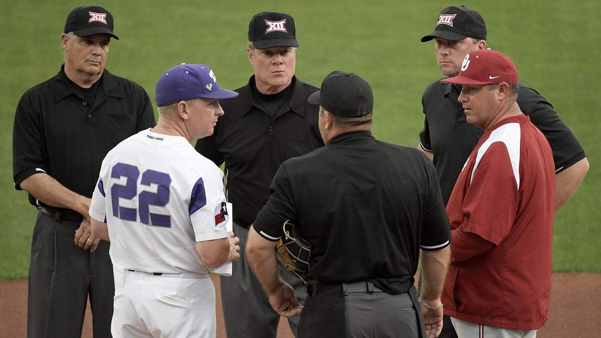 TCU head coach Jim Schlossnagle and Oklahoma head coach Skip Johnson meet at home plate before the game as OU plays TCU in Big 12 baseball at Lupton Stadium in Fort Worth, TX, Friday, April 6, 2018.  