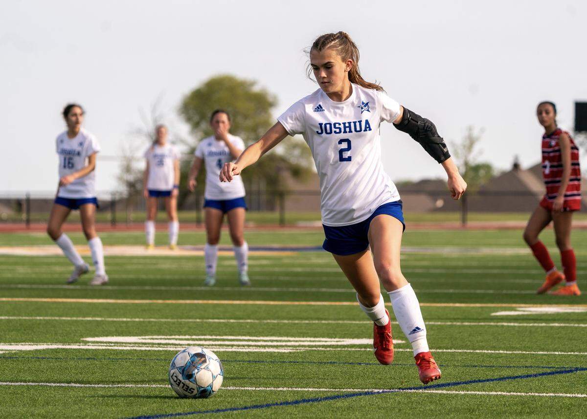 Joshua’s Kynli Miller winds up for a shot against Justin Northwest in a Class 5A area-round girls soccer match on Friday, March 29, 2024 at Boswell High School in Fort Worth ,Texas. Joshua won 4-1.
