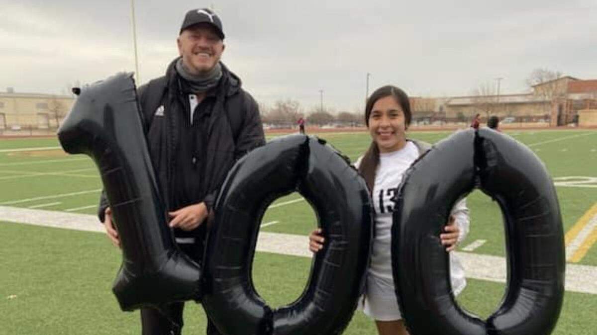 Fort Worth South Hills coach Jamie Southern and senior Cristal Saldivar celebrate Saldivar’s 100th career goal on Thursday Jan. 21, 2021