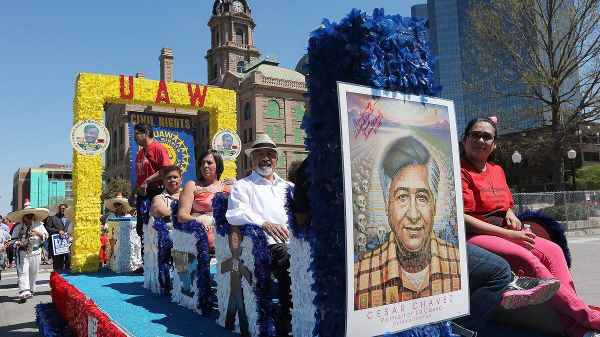In this file photo from March 29, 2014, a float leads about 1,000 participants marching through downtown Fort Worth to honor the birthday of American labor and civil rights activist Cesar Chavez.