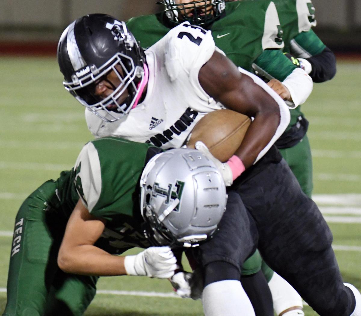 Trimble Tech’s Matthew Erwin, left, knocks South Hills’s Ca’lub Holloway out of bounds after a first down run in the second quarter of their Divison 2 District 4-5A football game Thursday, October 29, 2020 at Clark Stadium in Fort Worth, Texas. South Hills won 21-2. Special/Bob Haynes