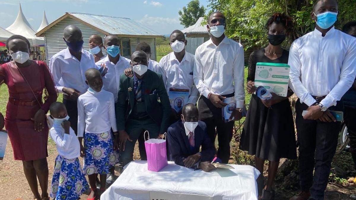 Volunteers get ready to distribute masks and other supplies to Nyanza villagers. The volunteers are the grandchildren of Joshua Opar, who lived in the Nyanza province and died of COVID-19 on July 3.