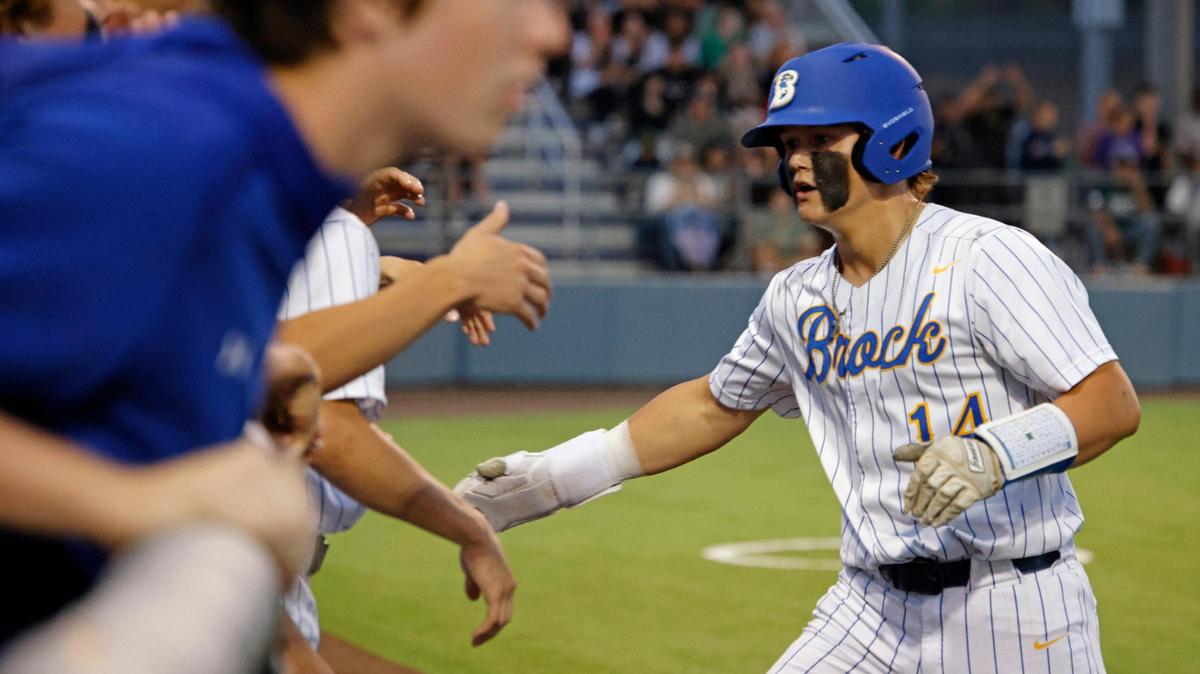 Brock third baseman Braxon Roberts (14) celebrates a score with team mates during a UIL Area Round 4A D2 baseball playoff game at Ranger Field in Saginaw, Texas, Friday, May 09, 2025.