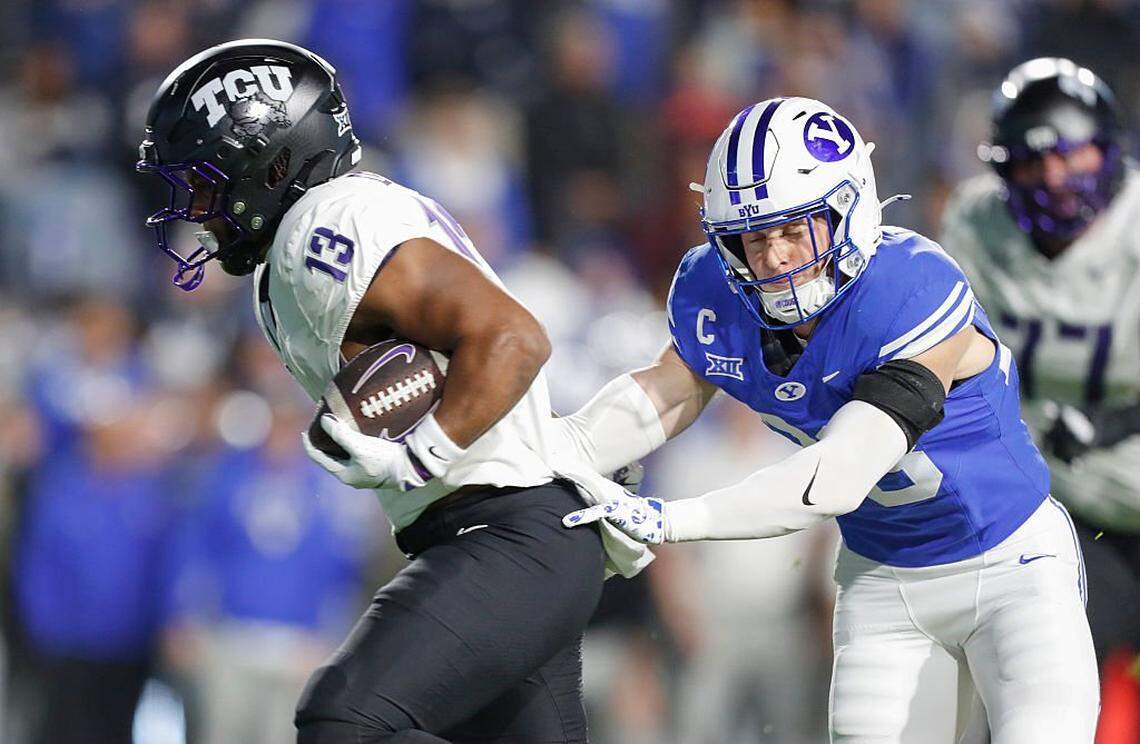PROVO, UT - NOVEMBER 15: Jon Denman #13 of the Texas Christian University Horned Frogs breaks a tackle to score a touchdown against Tanner Wall #28 of the Brigham Young Cougars during the first half of their game at LaVell Edwards Stadium on November 15, 2025 in Provo, Utah. (Photo by Chris Gardner/Getty Images)