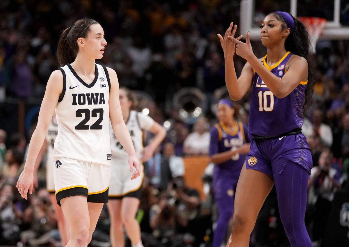 LSU forward Angel Reese (10) shows Iowa guard Caitlin Clark (22) her ring finger during final seconds of the NCAA Women’s National Championship basketball game in Dallas, Sunday, April 2, 2023. Hawks20 Jpg
