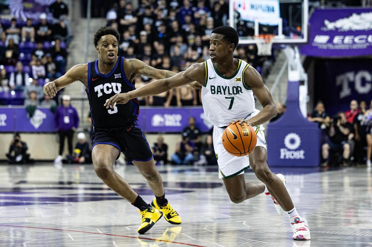 Baylor guard EJ Edgecombe (7) drives past TCU guard Vasean Allette (3) in the first half of an NCAA game between TCU and Baylor at Schollmaier Arena in Fort Worth on Tuesday, March 4, 2025.