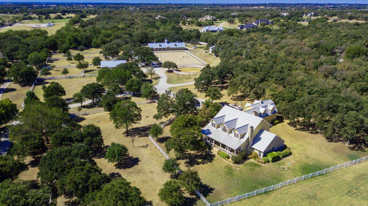 A 20-acre equestrian ranch at 1310 Gibbons Road in Bartonville near Dallas/Fort Worth will auction via Concierge Auctions. Open houses are held daily from 1 to 4 p.m. and by appointment.