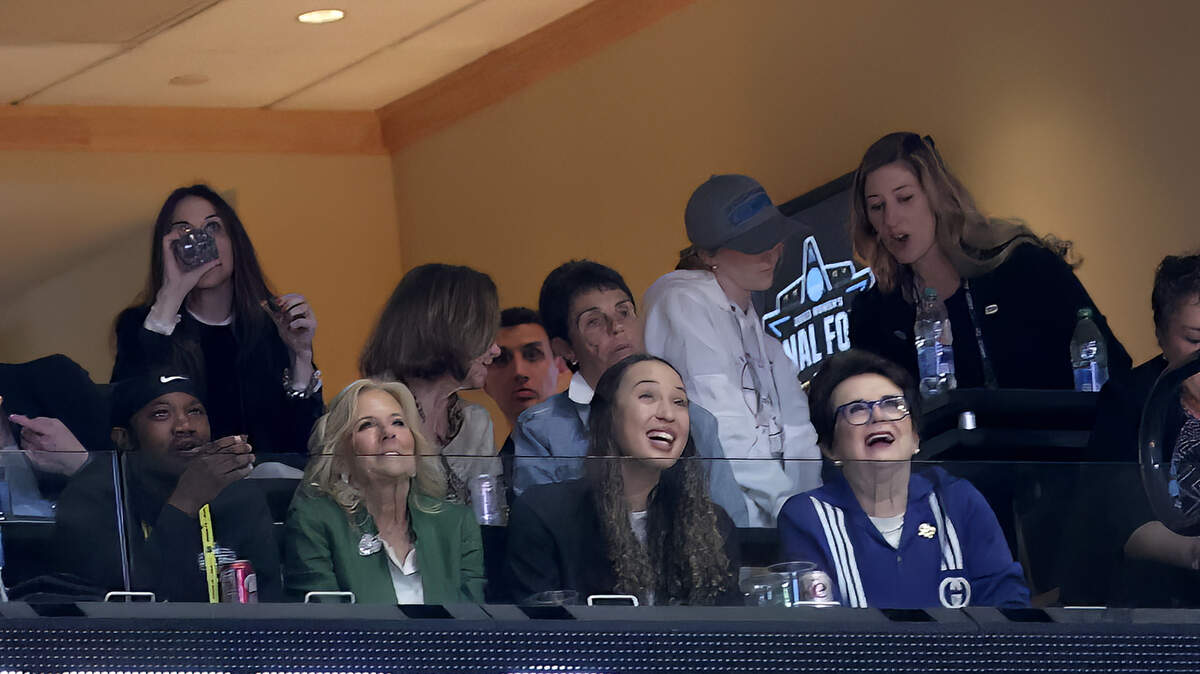 First Lady of the United States Jill Biden (in green) looks on from a suite in the first half of the game between the LSU Lady Tigers and Iowa Hawkeyes during the NCAA women’s final on Sunday in Dallas.