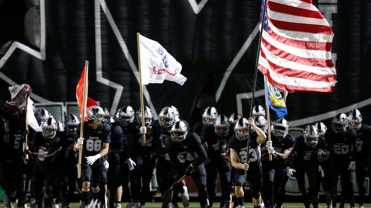 Martin players take the field before kickoff. The Bowie Volunteers played the Martin Warriors in high school football Thursday, November 7, 2019, at Maverick Stadium in Arlington, Texas.