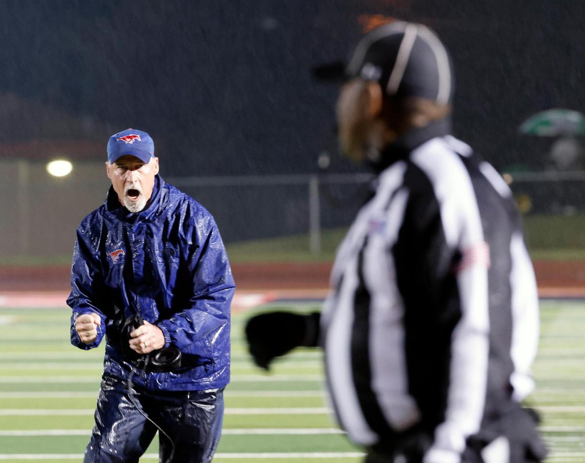 Grapevine head coach Bob DeBesse has a few words for an official in the second half of a UIL 5A D2 football playoff game at Mustang Panther Stadium in Grapevine, Texas, Thursday, Nov. 09, 2023.