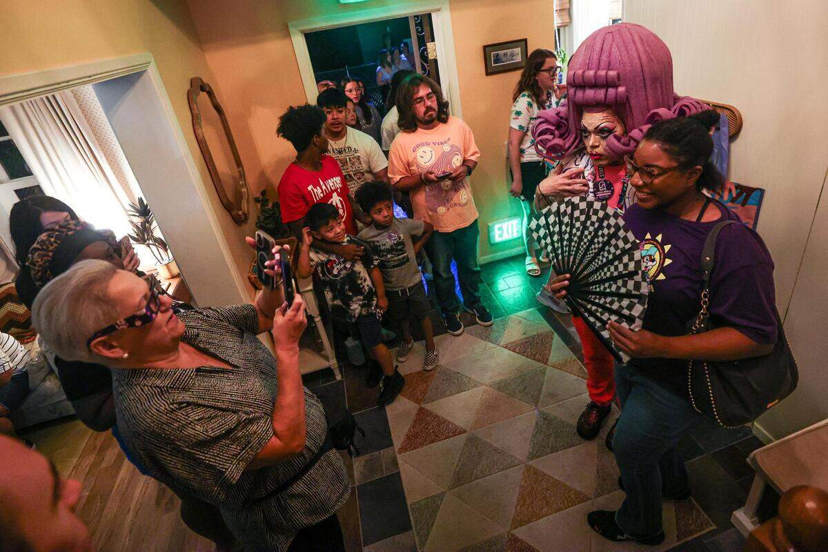 Exhibit attendees take photos in the house at the Meow Wolf Grapevine ‘The Real Unreal’ at the Grapevine Mills Shopping Mall in Grapevine, Texas on Thursday, July 20, 2023.