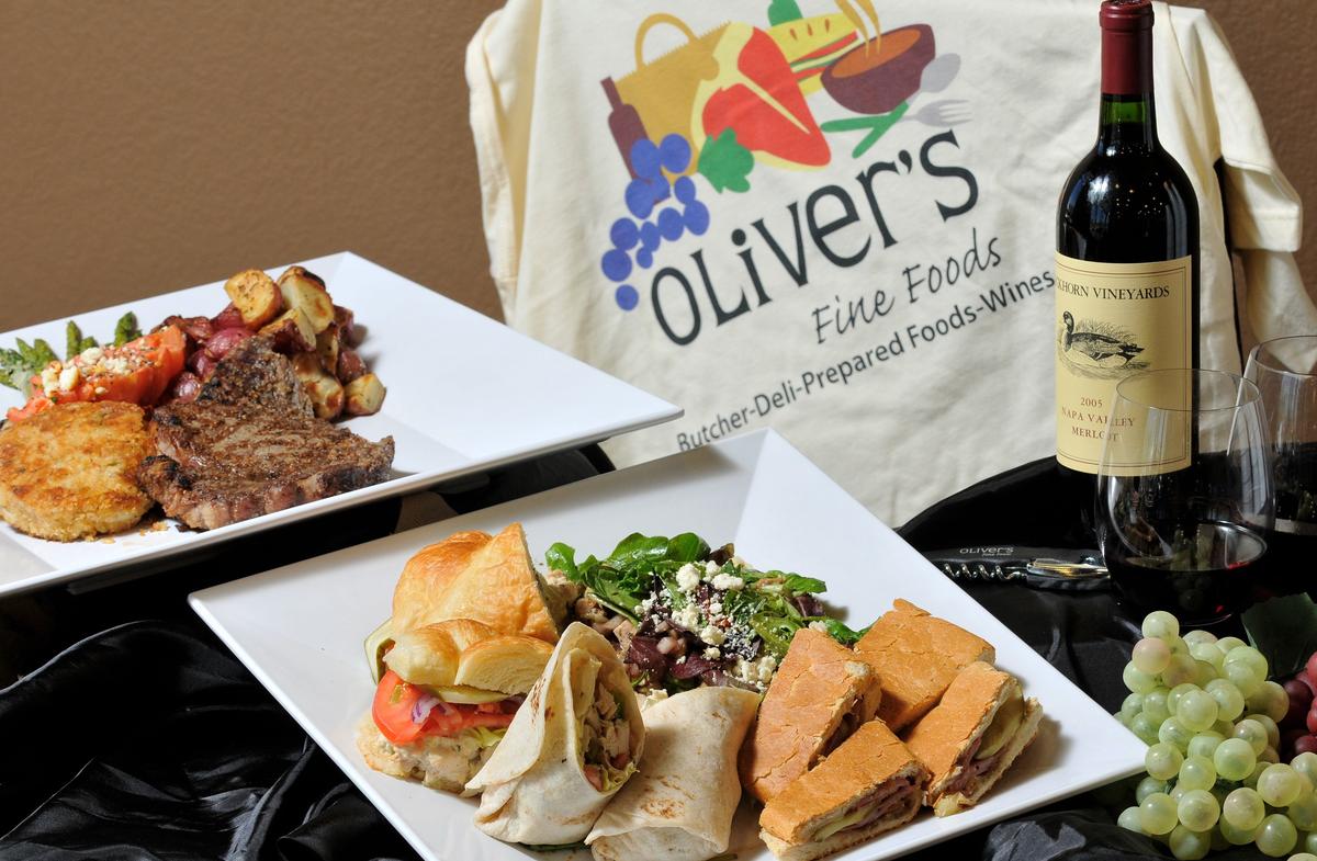 A file photo of some of the selections offered at the opening of Oliver’s Fine Foods in Mansfield: Marylan-style crab cake, blue cheese tomato, a ribeye steak and other vegetables, Cuan press pannini and balsamic chicken salad. The restaurant/grocery will close after service Dec. 15, 2018.