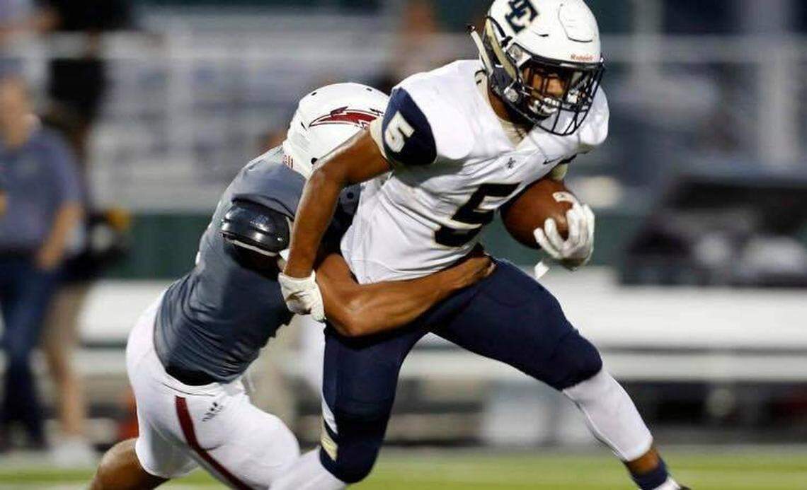 Little Elm running back Jason Jackson (5) is brought down by Keller Central linebacker Miles Skinner (2) during the first half of a high school football game at KISD Stadium in Keller, Texas, Saturday, Sept. 14, 2019. Central led 20-6 at the half. (Special to the Star-Telegram Bob Booth)
