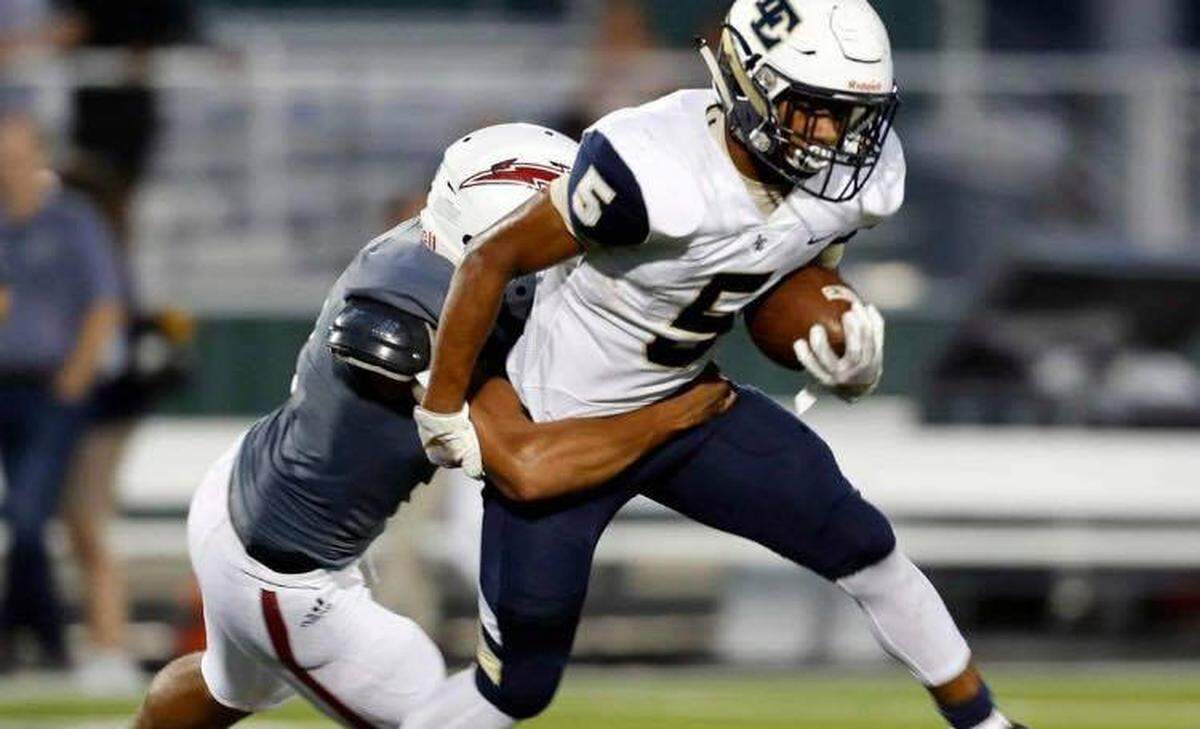 Little Elm running back Jason Jackson (5) is brought down by Keller Central linebacker Miles Skinner (2) during the first half of a high school football game at KISD Stadium in Keller, Texas, Saturday, Sept. 14, 2019. Central led 20-6 at the half. (Special to the Star-Telegram Bob Booth)