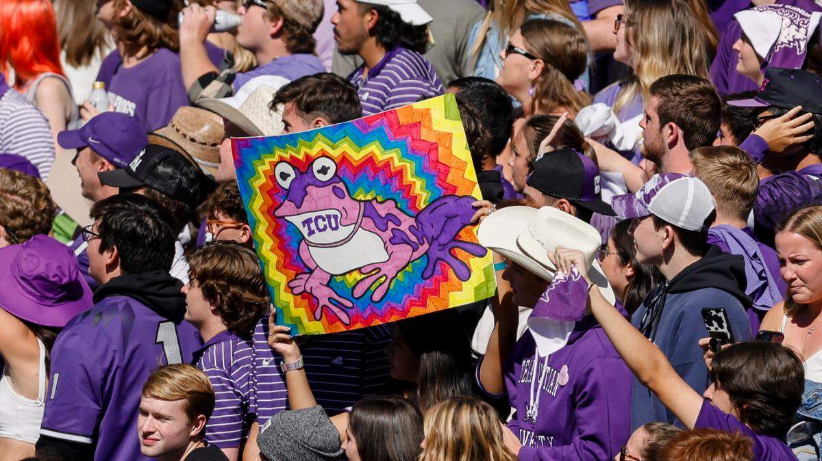 TCU fans hold up a “Hypnotoad” sign during the game during the game between the TCU Horned Frogs and the Texas Tech Red Raiders on Nov. 5 at Amon G. Carter Stadium.