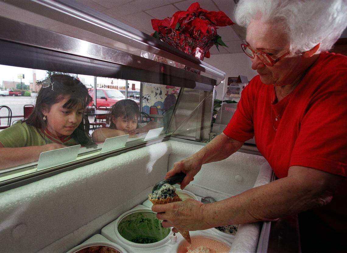 April 22, 1999: Blanch Williams, owner of Hurst Deli and Cafe, scoops ice cream for sisters Gloribel Martinez, 9, and Coraima Martinez, 5, of Hurst.