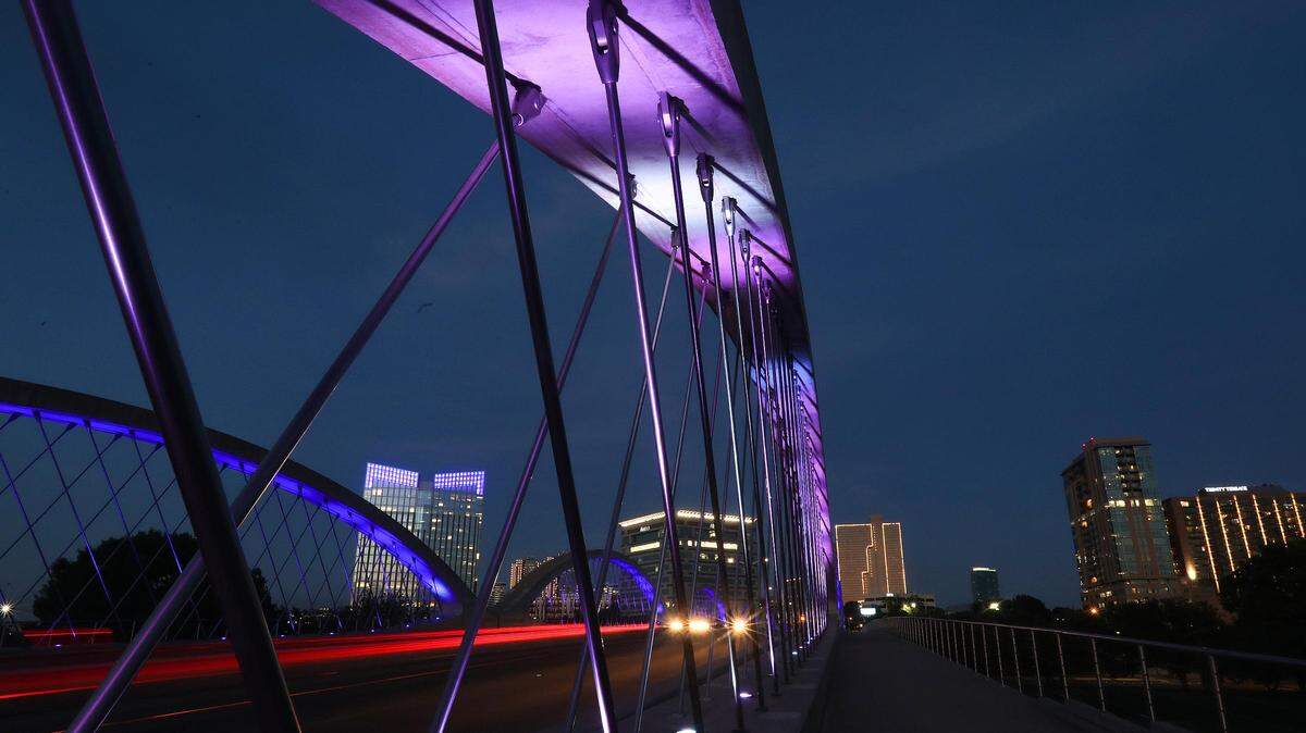 The West Seventh Street Bridge and Pier 1 Imports Building are lit in blue to show gratitude for first responders and healthcare workers working on the frontline during the coronavirus pandemic on Thursday, April 15, 2020.