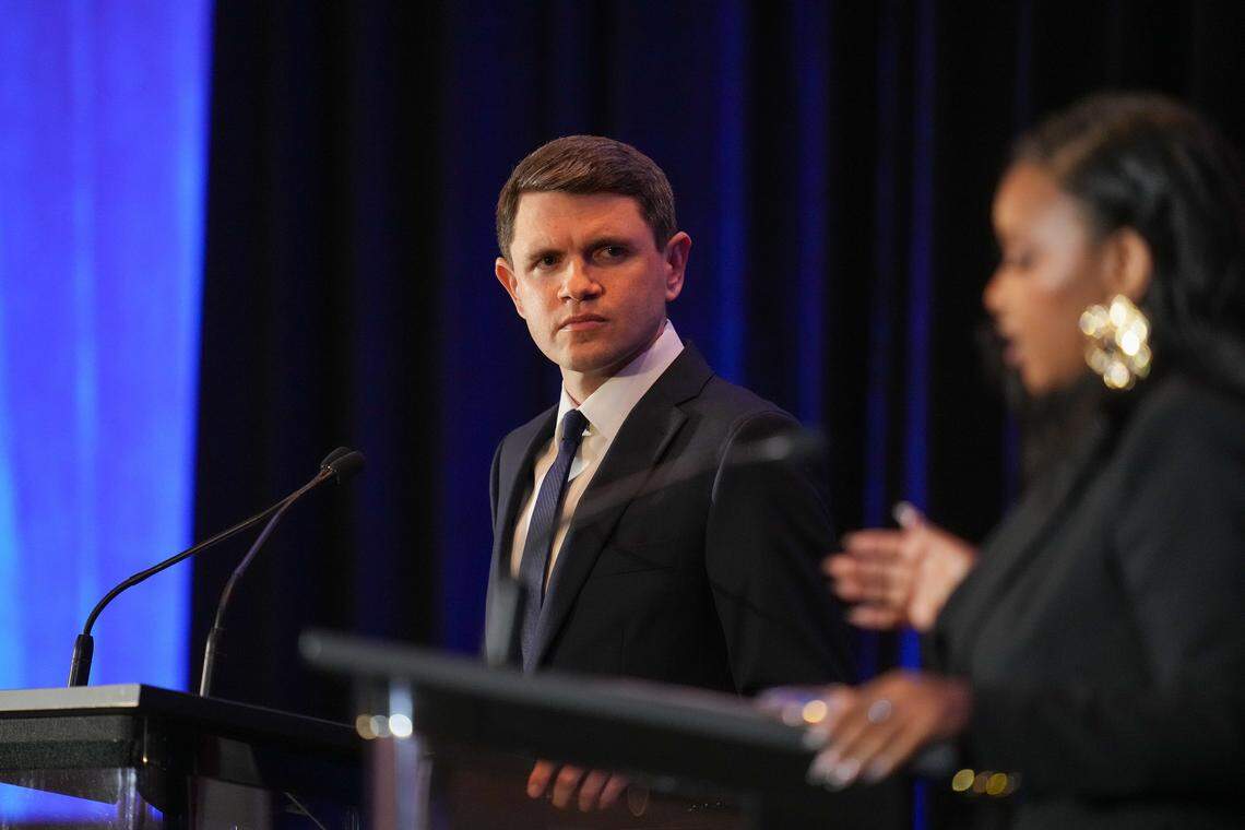State Rep. James Talarico, Democratic primary candidate for U.S. Senate, looks at U.S. Rep. Jasmine Crockett during a debate at the 2026 Texas AFL-CIO COPE Convention in Georgetown, Texas on Saturday, Jan. 24, 2026.
