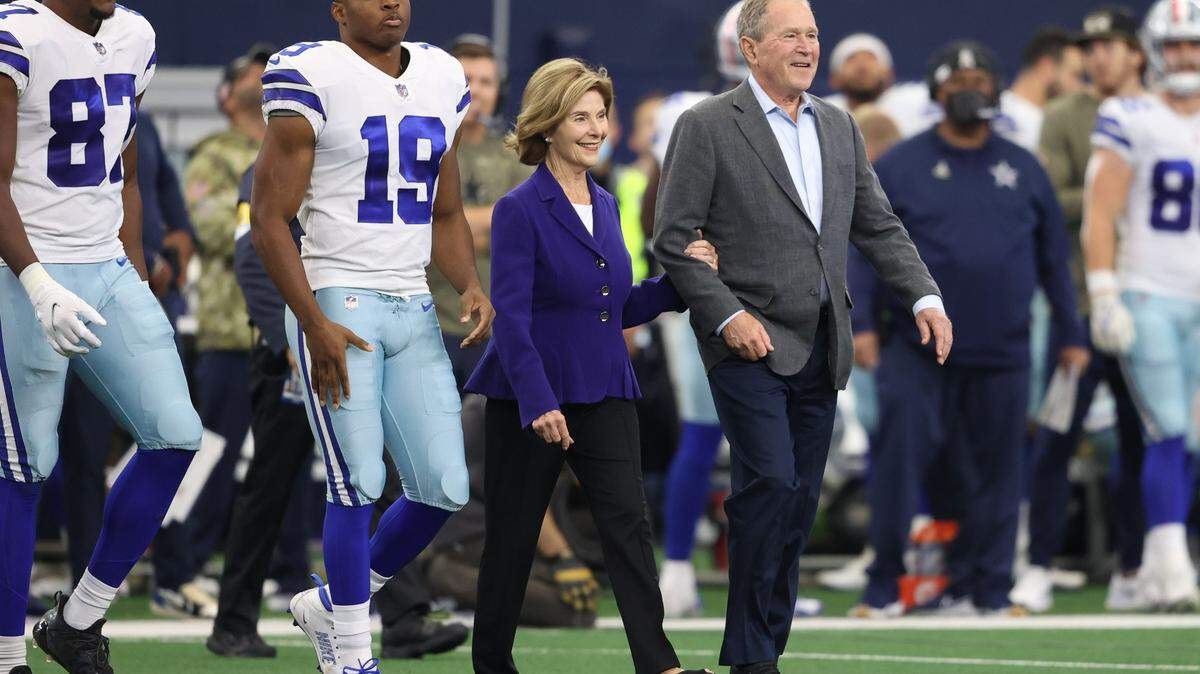 Former President George W. Bush and former First Lady Laura Bush took part in the coin toss before Sunday’s Dallas Cowboys game to help raise funds for the National Medal of Honor Museum in Arlington.