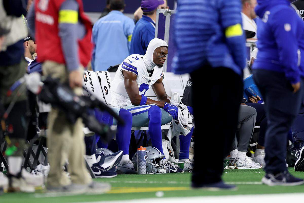 Cowboys wide receiver George Pickens sits on the sidelines during the final minutes of their loss to the Vikings on Sunday at AT&T Stadium.