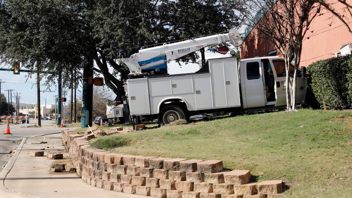 A driver who police said may have been having a medical emergency crashed into a main electricity feeder pole and into Hurst Fire Station No. 1 in Hurst, Texas, Tuesday, Jan. 4, 2022. The driver later died at a hospital.