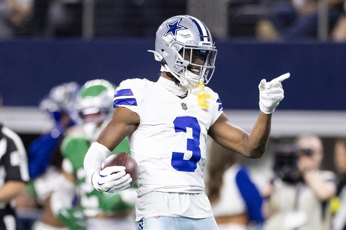 Cowboys receiver George Pickens (3) celebrates after catching a pass over multiple Eagles defenders in the second half of an NFL game between the Dallas Cowboys and the Philadelphia Eagles at AT&T Stadium in Arlington on Sunday, Nov. 23, 2025.