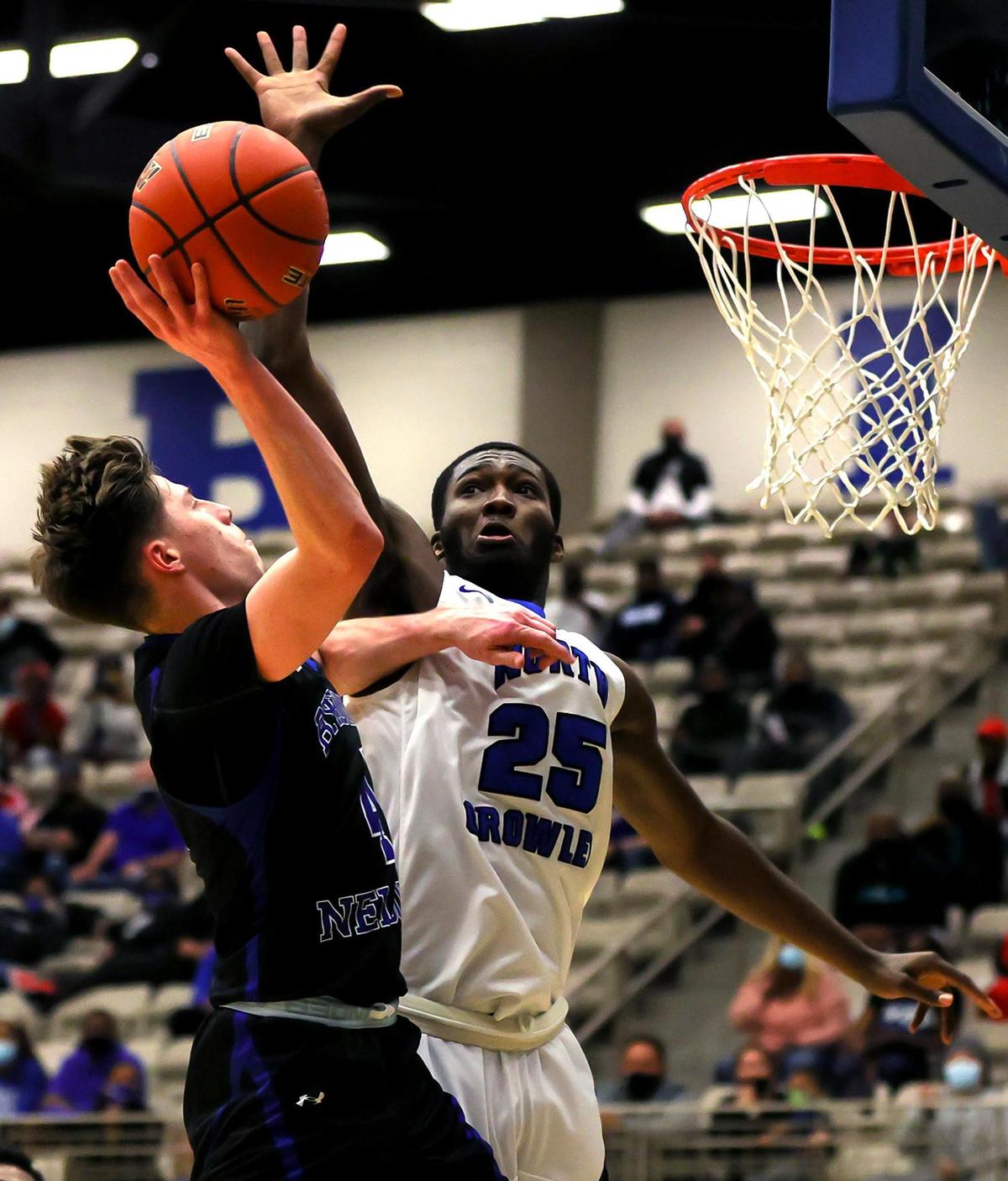 Byron Nelson guard Kaden Morgan (4) goes strong to the basket against North Crowley forward Bryan Thomas (25) during the second half, Friday, February 26, 2021 of a 6A Region 1 Quarterfinal High School playoff Basketball game played at the Thomas Coliseum in Haltom City, Tx. (Steve Nurenberg Special to the Star-Telegram)