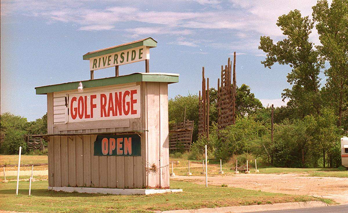 Sept. 30, 1990: Riverside Drive-in theater converted to golf range along Northeast 28th Street in Fort Worth. The rotted frame for the movie screen is in background.