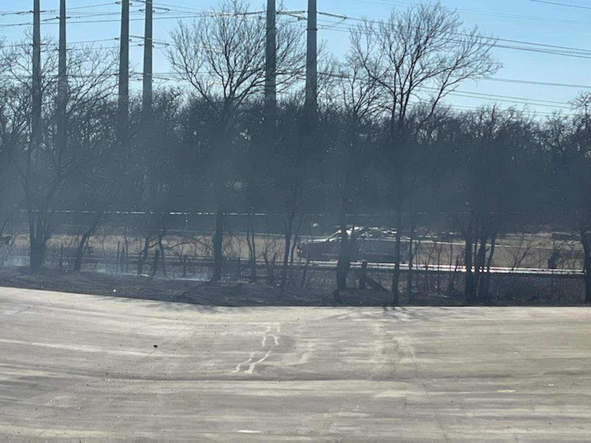 Emergency crews are on the scene of a large grass fire Tuesday afternoon, Feb. 15, 2022, near Kennedale in southeast Tarrant County. The fire was reported near Kennedale Parkway, and people were being evacuated from the area.