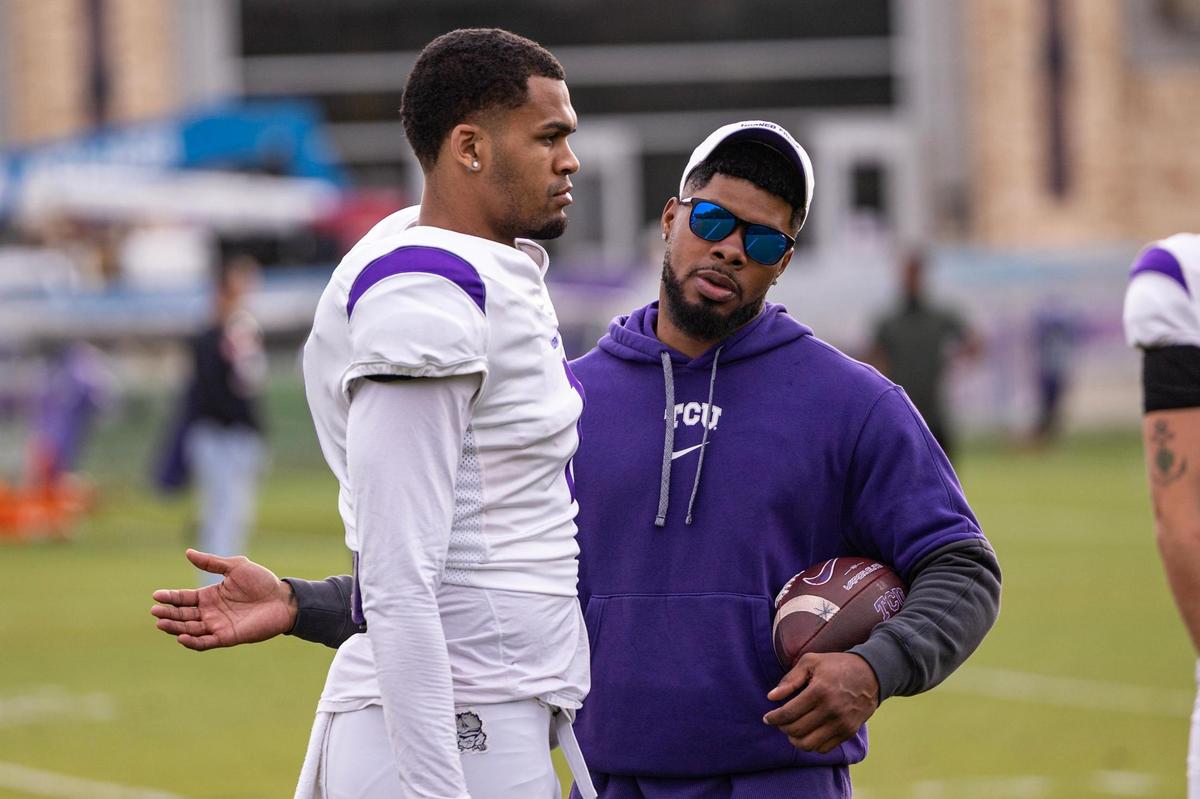 TCU wide receiver Eric McAlister speaks with assistant wide receivers coach Corey Coleman in a team spring practice at the Sheridan & Clif Morris Football Practice Fields at TCU on April 1.