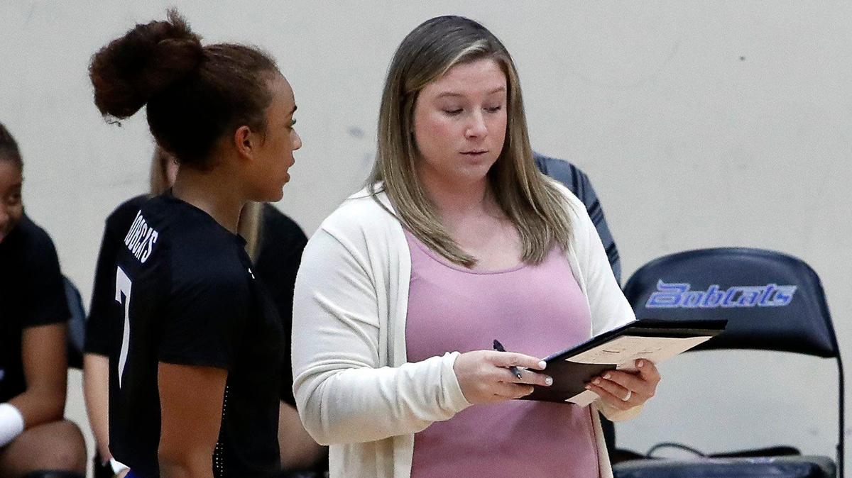Byron Nelson volleyball coach Brianne Barker-Groth, talking to Sydnee Peterson, during a game in September, faces complaints from a parent that she belittled players.