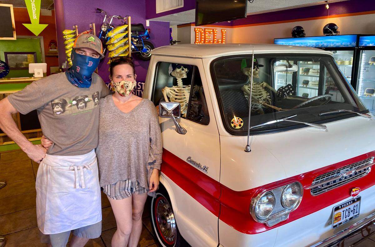 Todd and Natalie Brown with a 1961 Chevrolet Corvair pickup in the new Lettuce Cook location near TCU.