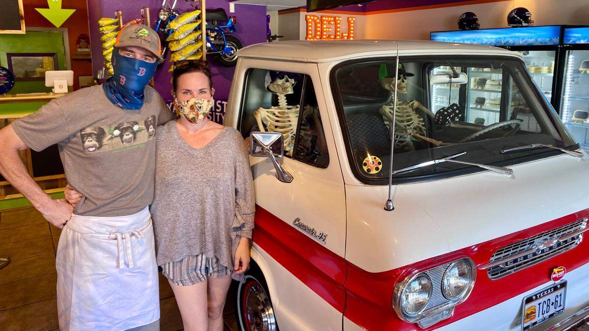 Todd and Natalie Brown with a 1961 Chevrolet Corvair pickup in the new Lettuce Cook location near TCU.