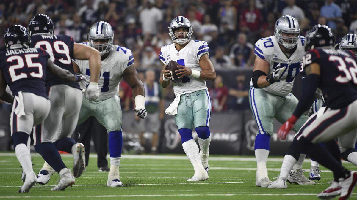 Dallas Cowboys quarterback Dak Prescott (4) looks to pass against the Houston Texans during the first half of an NFL football game, Sunday, Oct. 7, 2018, in Houston.