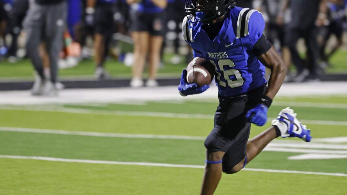 North Crowley receiver Pryce Demerson takes in the winning score during the second half of a UIL football game at Crowley ISD Stadium in Crowley, Texas, Thursday, August 28, 2025.
